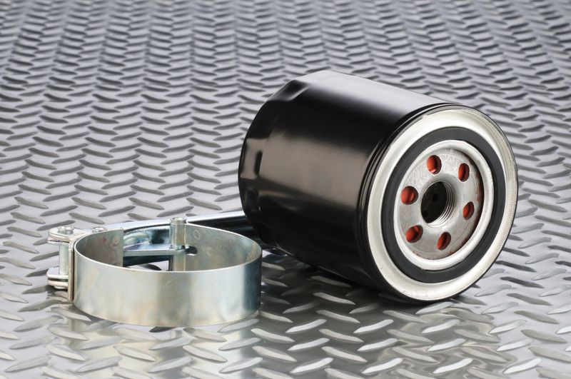 Motor Oil Filter and Filter Wrench on Diamond Plate Background. RELATED PHOTOS ON MY PORTFOLIO