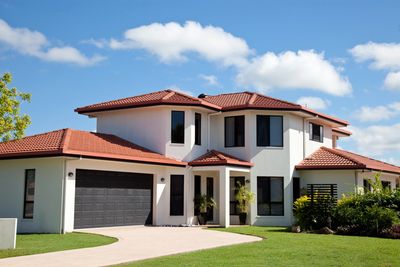 Closeup of new red clay ceramic roof tiles with a blue sky background in Parkland FL, 