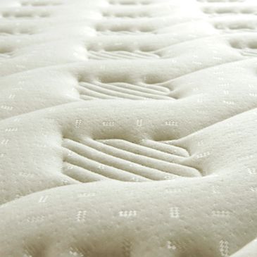Close-up of a mattress surface with patterns.