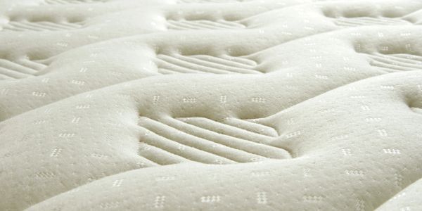 Close-up of a mattress surface with patterns.