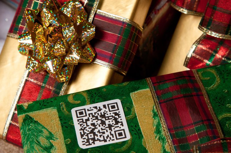 Christmas gift with QR code under the tree
