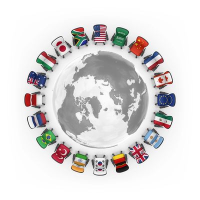 Office chairs with various national flags arranged around a globe.