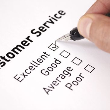 Hand checking 'Excellent' on customer service survey.