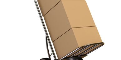 Hand truck carrying three stacked cardboard boxes with red handles.