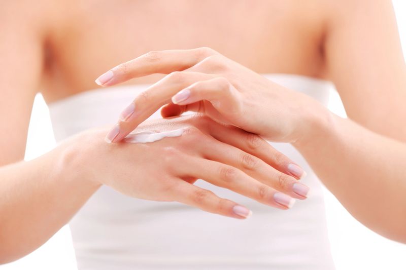 Beautiful woman caring her hands  - selective focus