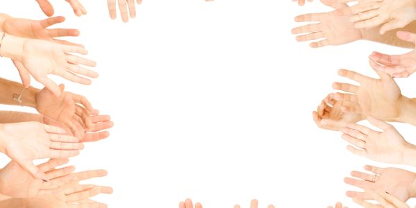 Multiple hands reaching inward, forming a frame around a white space.