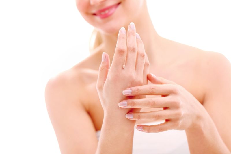 Beautiful woman caring her hands  - selective focus