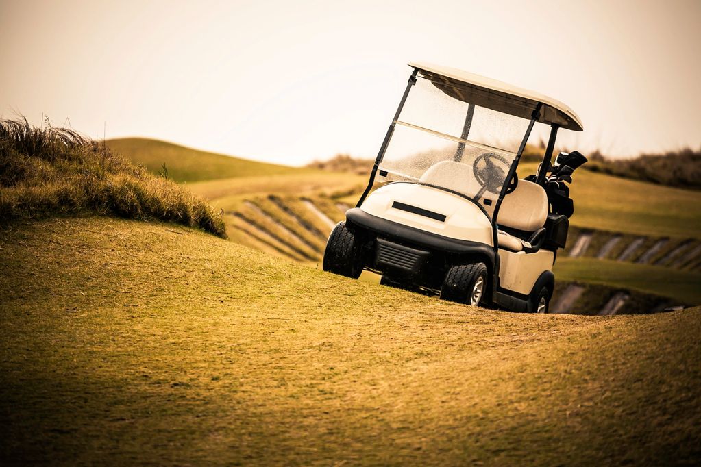Course turf with a scenic mountain backdrop