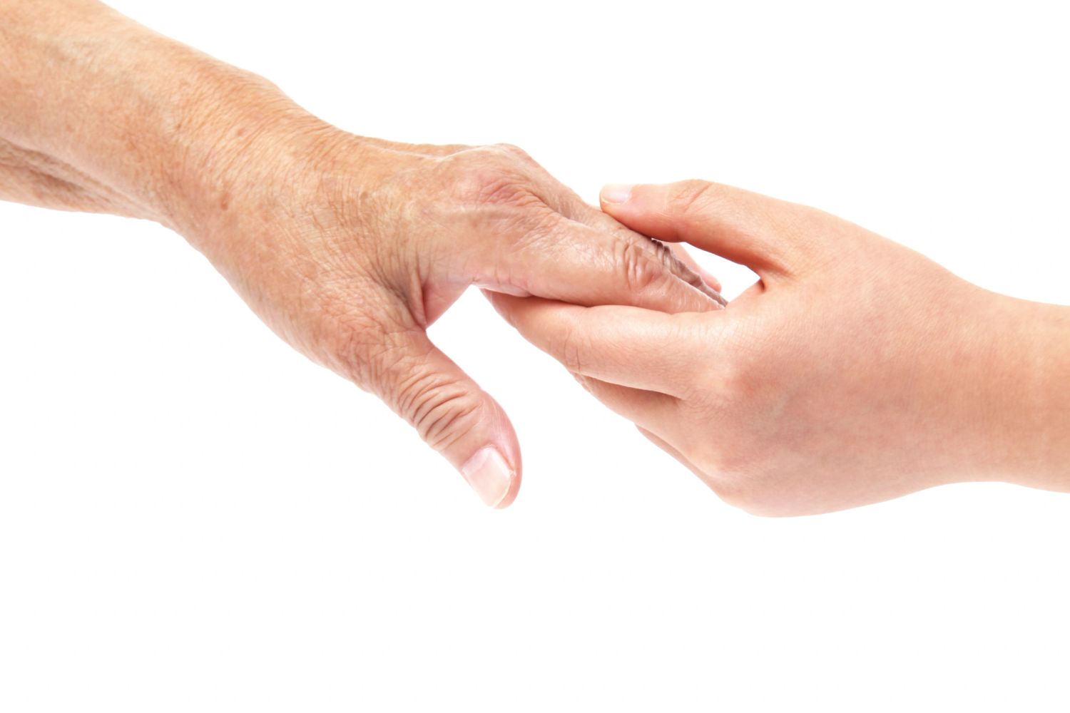 Two hands holding gently, one older and one younger.