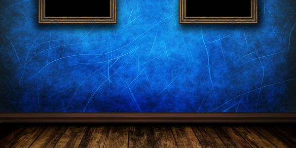 Empty room with blue textured walls and wooden floor.