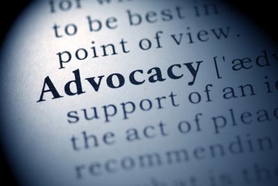 book showing the definition -Advocacy 