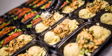 Pre-packaged meals with rice and vegetables.