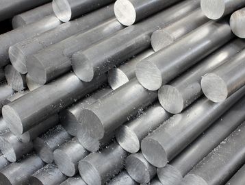 Stacked metal rods with round ends.