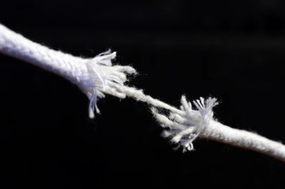 Frayed rope breaking apart, representing severing joint tenancy in Ontario real estate