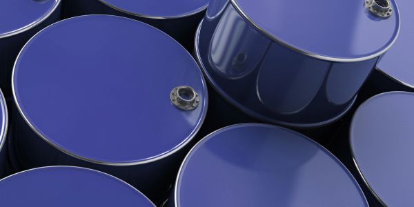 Close-up of several blue industrial barrels stacked together.