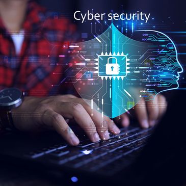 Person typing on laptop with digital cybersecurity graphics overlay.