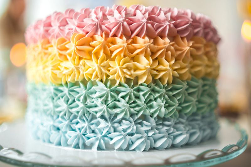 Beautiful colorful and delicious cake at a baby shower celebration displayed on a tray.