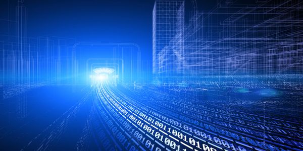 Three computers are lined up on a desk.