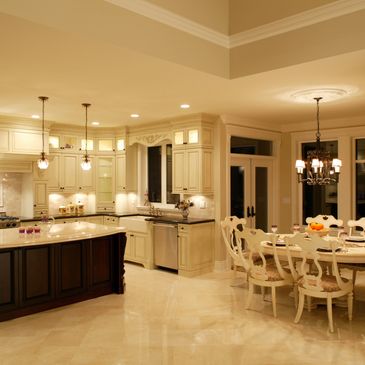 Elegant kitchen and dining area with warm lighting and classic decor.