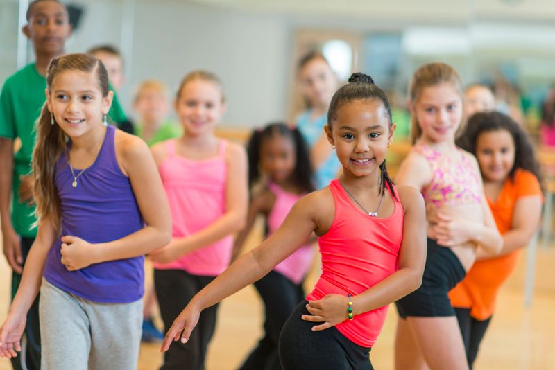 Diverse group of children taking a dance fitness class