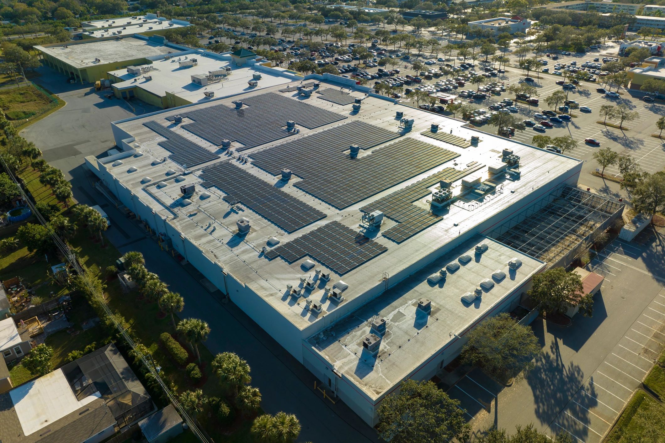 Large commercial building with solar panels on the roof.