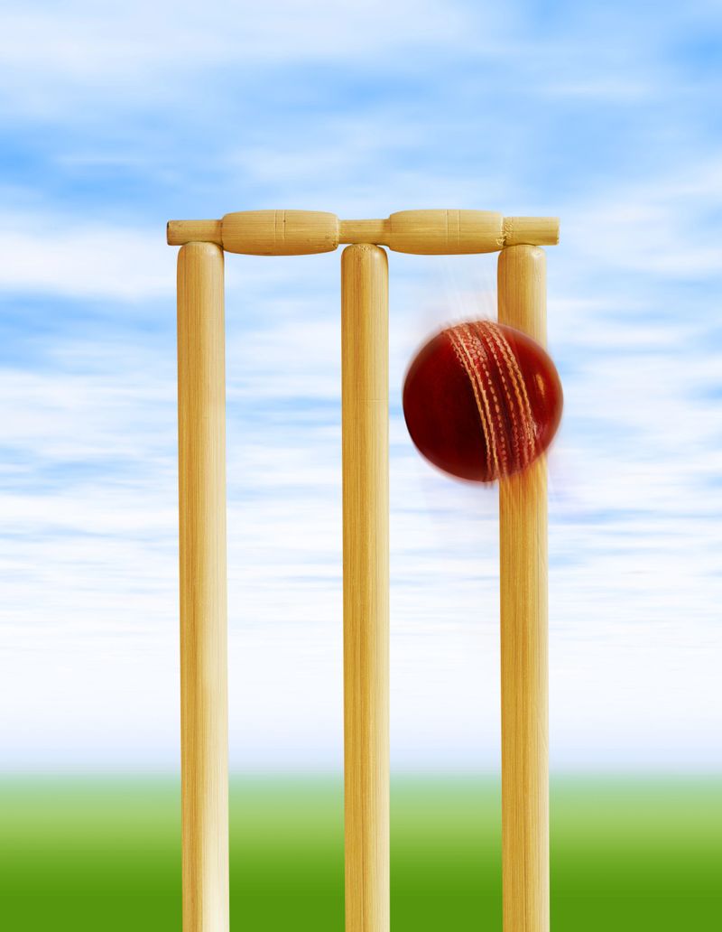 cricket ball about to hit cricket stumps