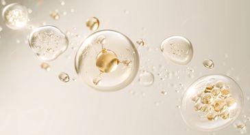 Golden and transparent bubbles floating in a soft beige background.