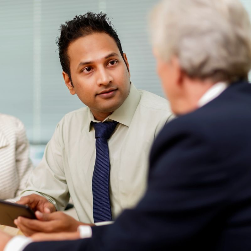 A businessman and senior business people having a meeting.  