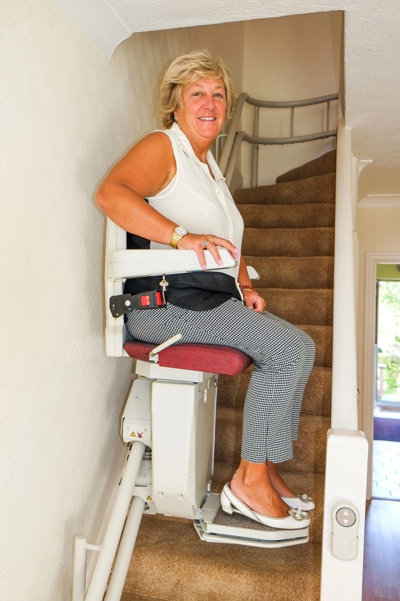 A stair lift that has been installed inside a domestic residence.