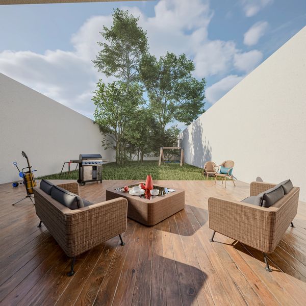 Cozy outdoor patio with wicker furniture and fire pit under a bright sky.