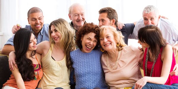 A diverse group of friends laughing and enjoying each other's company.