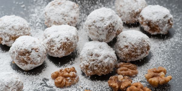 Snowballs Russian TeaBalls with confection sugar, butter and pecans