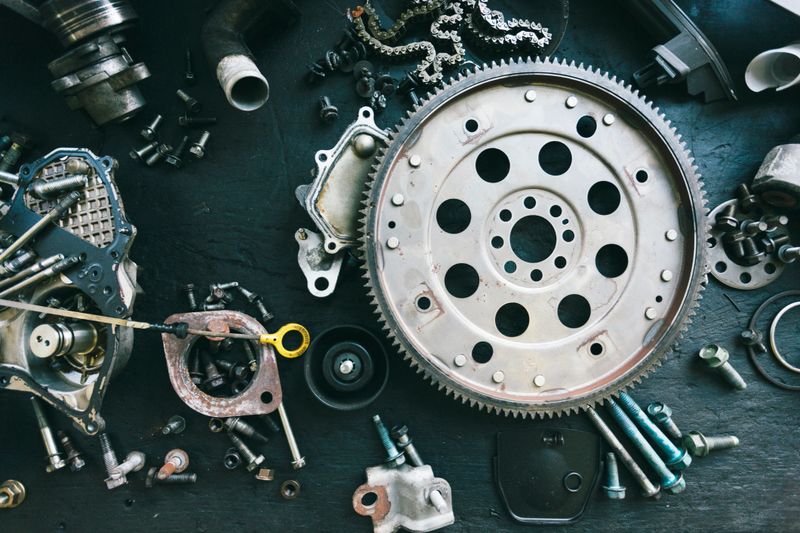 Car parts displayed on a workbench