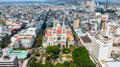 A large cathedral in a dense urban cityscape.