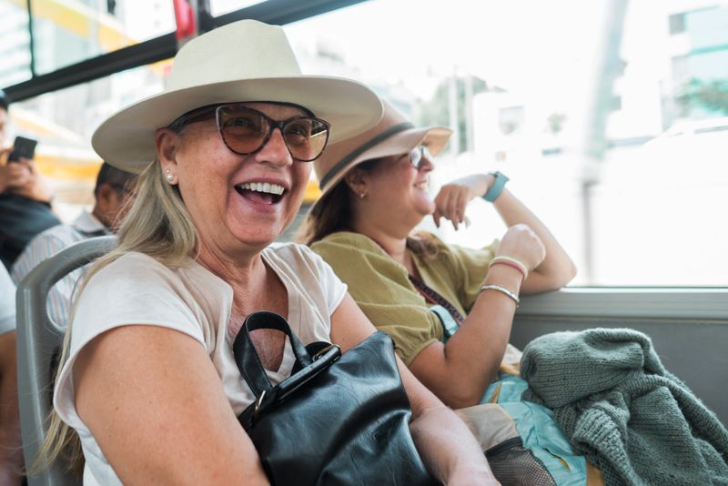 Tourists travel happily on the bus on vacation.