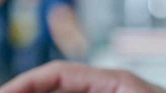 Close-up of a hand using a smartphone.