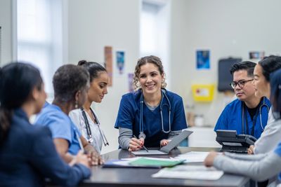 Medical team in discussion during a meeting.