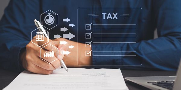 Person filling out tax forms with digital icons representing time, calculator, and statistics.