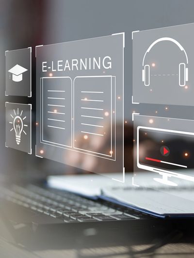 Digital e-learning concept with icons and laptop.