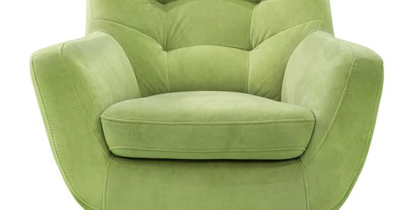 Green upholstered armchair with wooden legs.