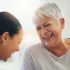 Two women laughing and enjoying a moment together.