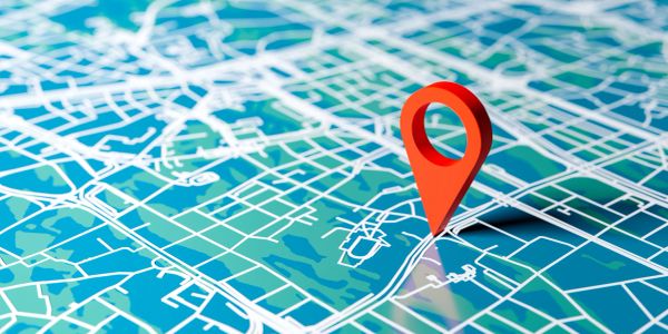 Red location pin on a city map.