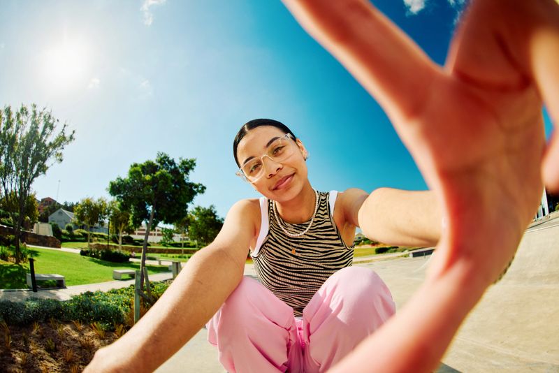Carefree Generation Z Girl in Front of Blue Sky