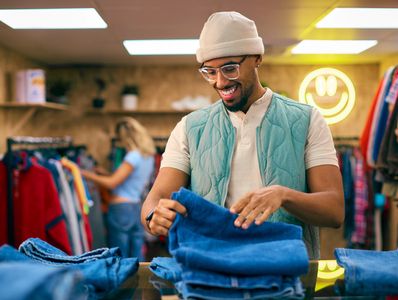 potential client looking through a pile of jeans