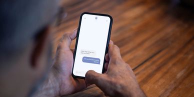 Person reading messages on a smartphone.