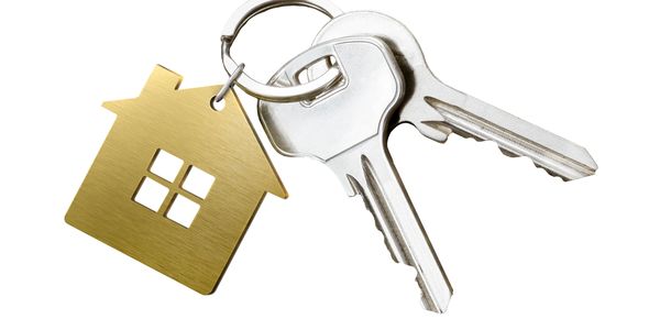 House-shaped keychain with two silver keys.