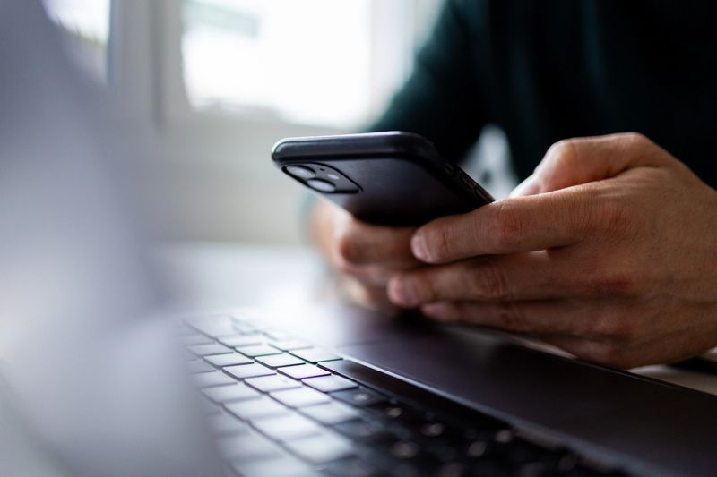 Focus on man hands typing message