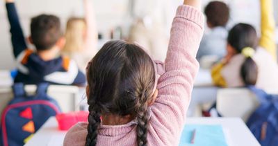 Kids raising hands
