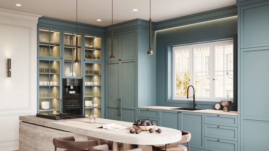 A scenic landscape featuring mountains, trees, and a clear blue sky.