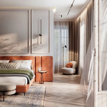 A modern, stylish bedroom with warm lighting, a neatly made bed, soft furnishings, and large windows